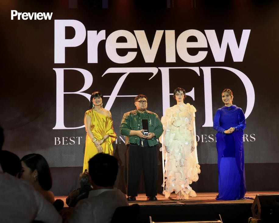 Renz Reyes walks up the stage with his muse, Luisa Jocson of PMAP.